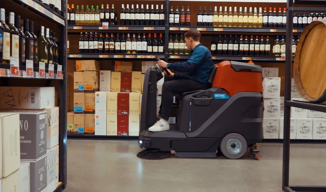 Meijer SR750C sweeping and scrubbing a shop floor in a single pass